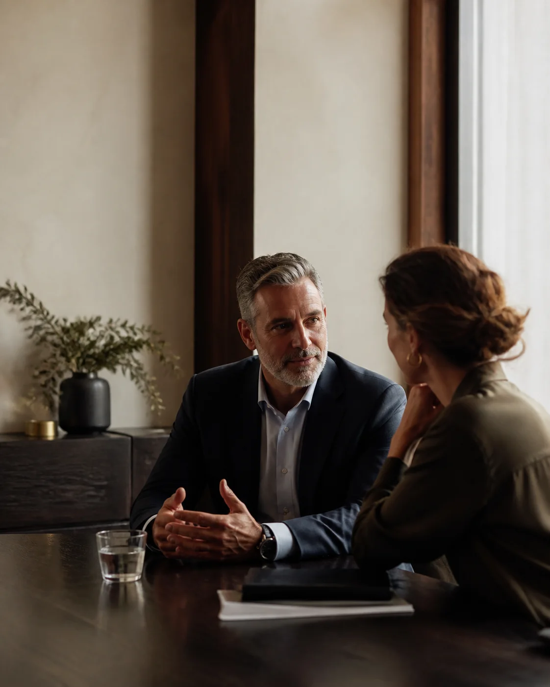 Two professionals in a focused recruitment conversation